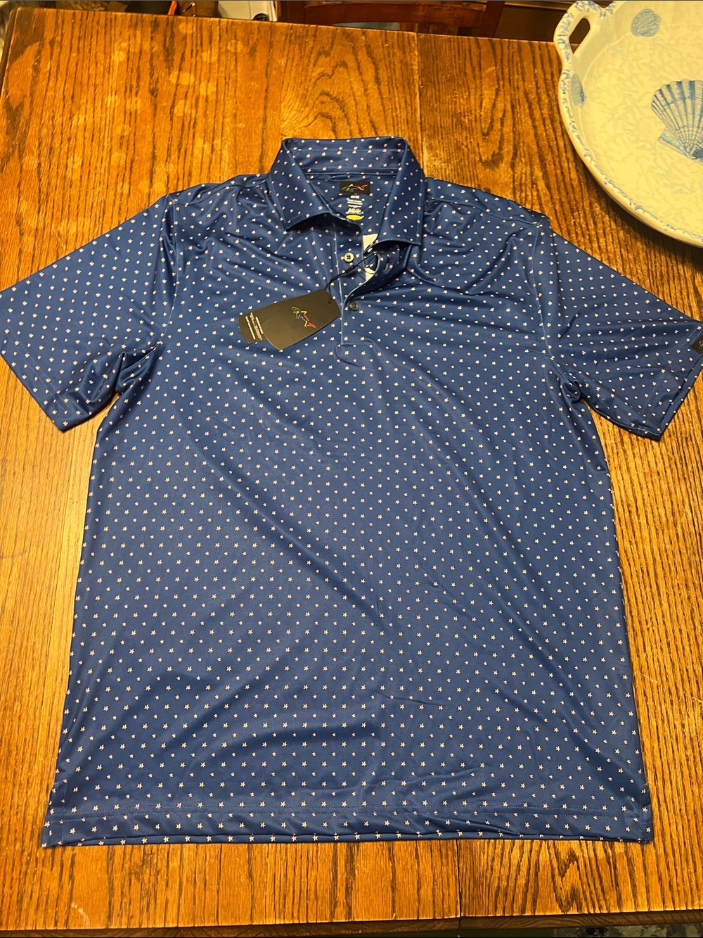 NWT Greg Norman Collection Navy Polo with White and red star  Pattern